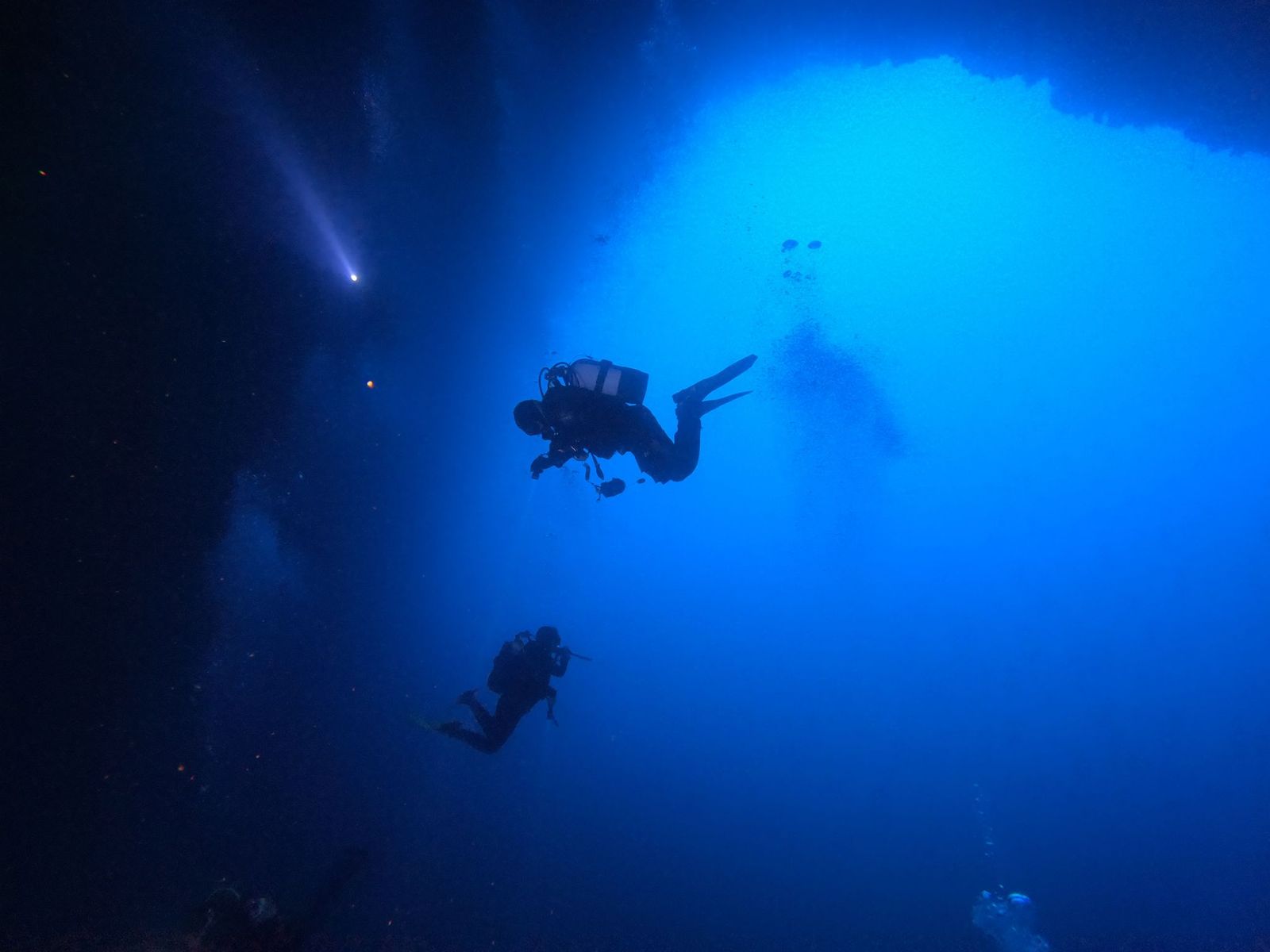 Divers Deep Diving